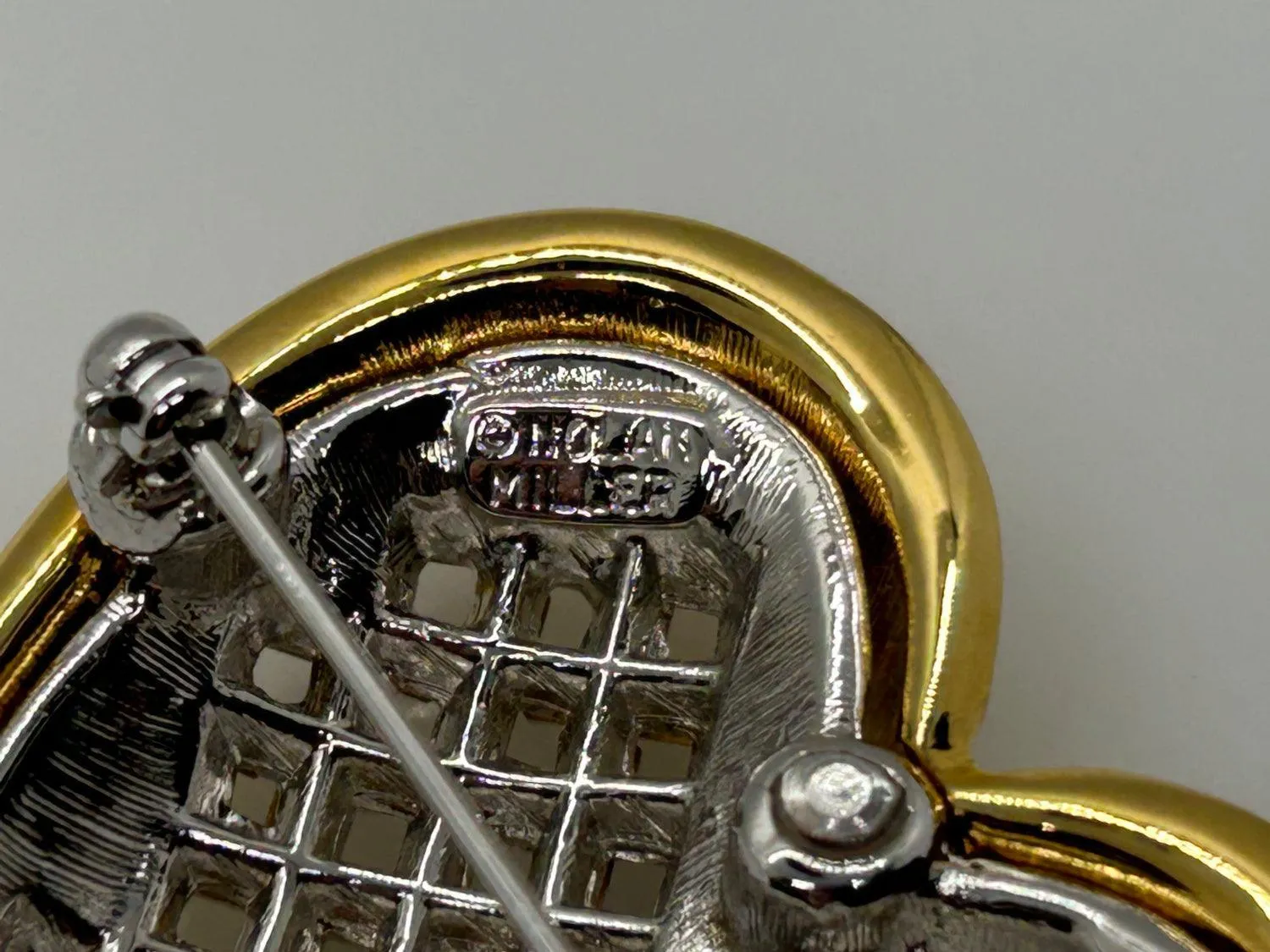 Dramatic Nolan Miller Sparkling Baguette Woven Look Heart Brooch